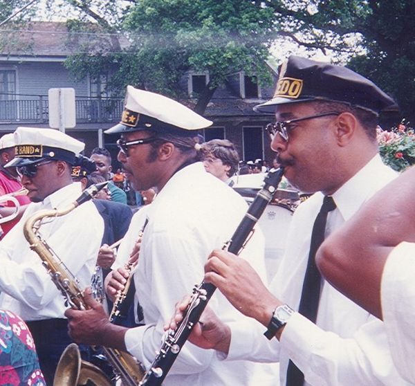 Musicians play for a funeral leaving St. Augustine Church in the Tremé neighborhood; Michael White in foreground.