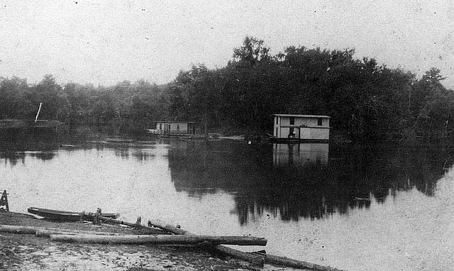 Floating saloons on the Pearl River. The "Blue Goose" (left) and "Freeman Saloon" (center), near Old Gainesville, Hancock County, Mississippi, 1907.