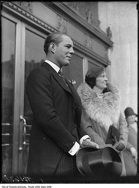 Flora McCrae Eaton and son John David Eaton at opening of store on College Street.jpg