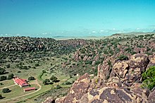 Photograph from above of landscape with building