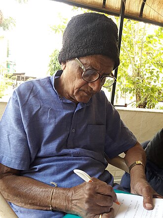 Harikrishna Pathak writing at his home, 2018 Harikrishna Pathak.jpg