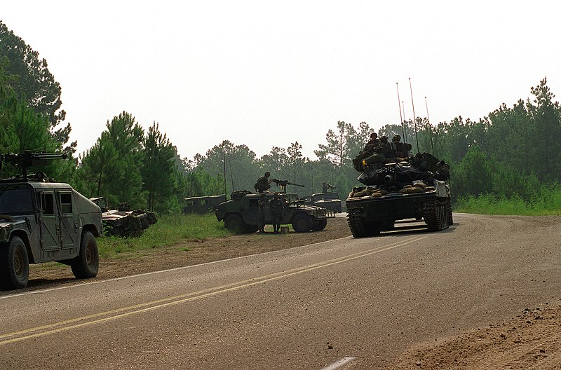 File:Heavy armor and High-Mobility Multipurpose Wheeled Vehicles (HMMWV), on patrol at the Joint Readiness Training Center. The HMMWVs are equipped with .50 caliber machine guns mounted - DPLA - 5ffff6e1ddfe2e73a29c46cd98ff993a.jpeg