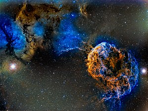 Jellyfish Nebula by Ram Samudrala. Data collected over two years reveals the supernova remnant interacting with the molecular clouds surrounding it, seemingly as though it is striking them with bolts of lightning.