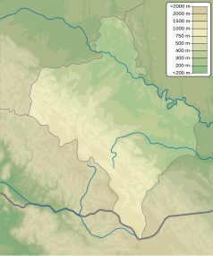 Mapa konturowa obwodu iwanofrankiwskiego, na dole znajduje się czarny trójkącik z opisem „Uchaty Kamień”