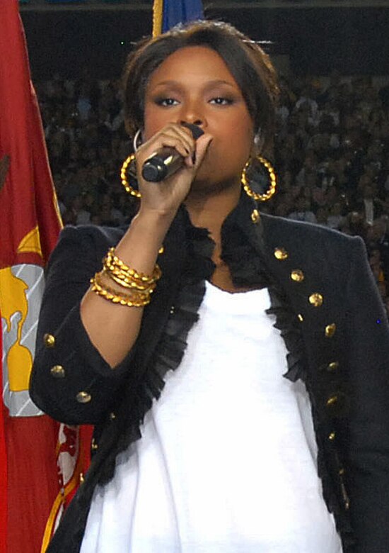 Jennifer Hudson's first public appearance after the murder of three family members, including her mother, sings the "National Anthem" at Super Bowl XL