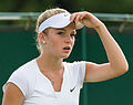 Katie Swan competing in the first round of the 2015 Wimbledon Qualifying Tournament at the Bank of England Sports Grounds in Roehampton, England. The winners of three rounds of competition qualify for the main draw of Wimbledon the following week.