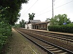 Reception building on the right of the train