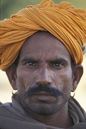 Rajasthani man wearing a paggar style of turban. Man jaisalmer turban.jpg