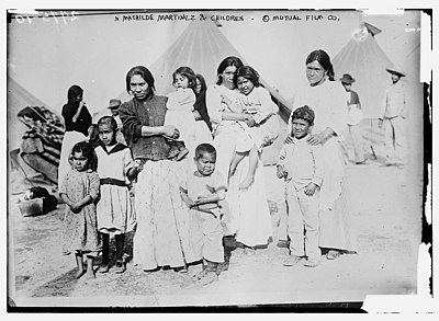 Refugees of the Mexican Revolution standing among tents, possibly in Marfa, Texas, ca. 1910
