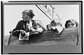 Mexican woman and children looking over side of truck fsa.3c29778u.jpg