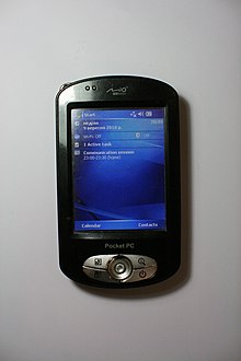 Windows Mobile 5 экранын көрсететін Mio P550 Pocket PC суреті.