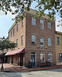 When the Union Army entered Savannah, Georgia during the American Civil War, they occupied what is now called the John Montmollin Building; it had a large sign that read "A. Bryan's Negro Mart" and was described as having "handcuffs, whips, and staples for tying, etc. Bills of sale of slaves by hundreds, and letters, all giving faithful description of the hellish business." The building became one of two schools for children of freedmen that were opened January 10, 1865. The schools had 500 students, and were operated by the Savannah Educational Association, which was "supported entirely by the freedmen, [and] collected and expended $900 for educational purposes in its first year of operation." Montmollin Building.jpg