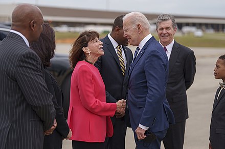 Manning greeting President Joe Biden in April 2022