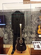 The clothes and guitar of Johnny Cash on exhibit