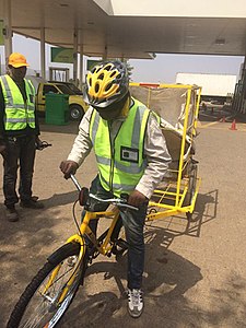 Recyclable collector trying out the brand new bicycle that he'll be using to collect recyclable material and supplementing his income by transporting other small loads for community members.