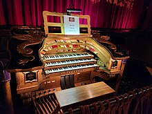 The organ console, with the lift in the lowered position Redford Theatre organ 2.jpg