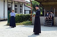 School mistress, pastor and children reenactors in the Haspengouw village, Bokrijk, 2019.jpg