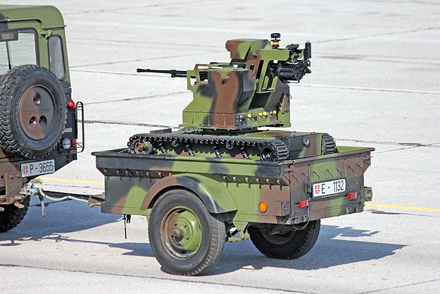 Serbian Land Rover Defender towing trailer with "Miloš" tracked combat robot