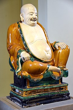 Glazed ceramic sculpture of Budai. Ming dynasty, 1486.