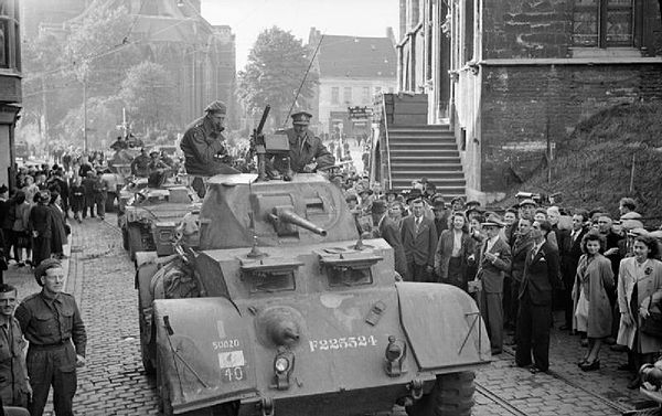 Major General Gerald Lloyd-Verney, GOC 7th Armoured Division, enters Ghent in his Staghound armoured car, 8 September 1944.