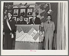 LULAC encouraged assimilation of its members into white U.S.A. culture. The president of the Mexican colony addresses the audience at the Mexican Independence Day program, Saint Paul, Minnesota.jpg