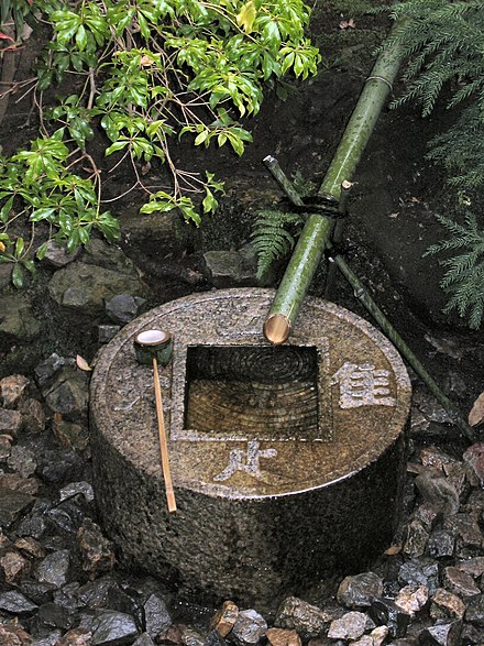 Tsukubai provided at a Japanese temple for symbolic hand washing and mouth rinsing