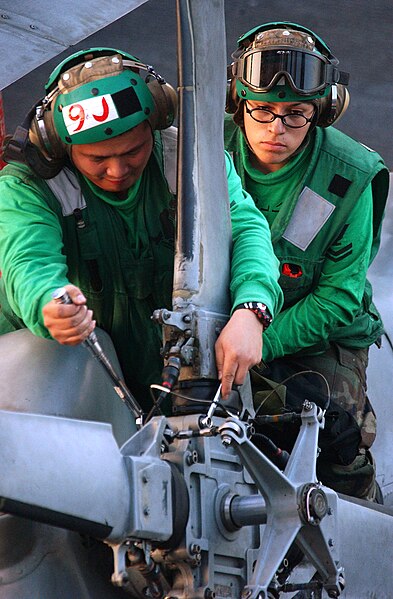 File:US Navy 060228-N-4776G-155 aviation machinist's mates assigned to Helicopter Anti-Submarine Squadron Four (HS-4) perform maintenance on a helicopter's rotor assembly on the flight deck of the Nimitz-class aircraft c.jpg