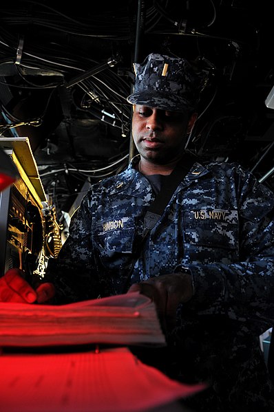 File:US Navy 120113-N-SB587-202 A Sailor updates a log on the bridge.jpg