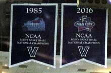 Villanova Wildcats' 1985 and 2016 NCAA national championship banners on display in the Wells Fargo Center rafters; the Wildcats play select home games at the Wells Fargo Center. Villanova Banners.jpg