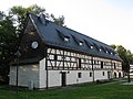 Two farm buildings and enclosure of the former manor