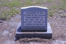 Monument in Oaklawn Cemetery to the victims of yellow fever epidemics. Yellow fever monument.jpg