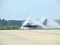 An F-22 Raptor gets a "bird bath" near the end of the runway here at the TYNDALL AIR FORCE BASE. Because of Tyndall's coastal location, corrosion is accelerated by the salty sea air. To combat this, the jets are washed on a daily basis to rinse off the salt residue and prevent corrosion.