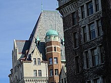 Designed in a Chateauesque-style, The hotel features steep pitched roofs, gables, and polygonal turrets. Architectural Detail - Empress Hotel - Victoria - BC - Canada - 01 (16662647148) (2).jpg