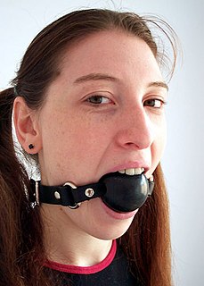 A gag is a device used in sexual bondage and BDSM roleplay. Gags are usually associated with roleplays involving bondage, but that is not necessarily the case. The person who wears the gag is regarded as the submissive partner, while the other is regarded as the dominant one.