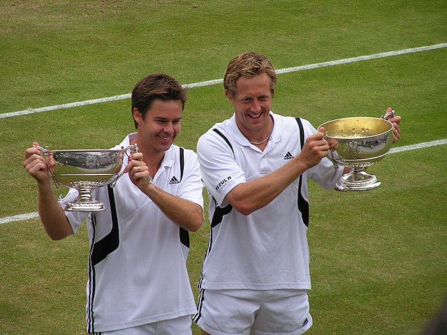 Jonas Björkman (right, pictured here with 2003 champion Todd Woodbridge, left) share a record of three finals in Halle (1999, 2002–03), taking the tit