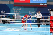 Deutsch: Boxen bei den Olympischen Jugendspielen 2018 Tag 12, 18. Oktober 2018 - Kampf um die Bronzemedaille im Fliegengewicht Mädchen – Heaven Destiny Garcia (USA, blau) schlägt Goryanana Stoeva (Bulgarien, rot) 5-0; Ringrichter ist Ishanguly Meretnyyazov (Turkmenistan). English: Boxing at the 2018 Summer Youth Olympics on 18 October 2018 – Girl's flyweight Bronze Medal Bout - Heaven Destiny Garcia (USA, blue) beats Goryanana Stoeva (Bulgaria, red) 5-0; Referee is Ishanguly Meretnyyazov (Turkmenistan). Español: Boxeo en los Juegos Olímpicos Juveniles de Verano de 2018 en 18 de octubre de 2018 - Combate a medalla de bronce de peso mosca para mujeres: Heaven Destiny Garcia (Estados Unidos, azul) le gana a Goryanana Stoeva (Bulgaria, roja) 5-0; El árbitro es Ishanguly Meretnyyazov (Turkmenistán).