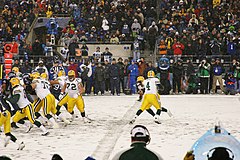 Favre hands off the ball to a running back