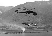 A Sikorsky CH-54 Tarhe lifting an F-100A to Hill Air Force Base, Utah for static display, 1979 CH-54 lifting F-100A to Hill AFB 1979.JPEG