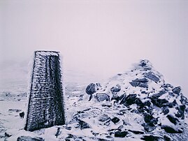 Trig point and cairn on the southern peak of Ben Vorlich – the highest summit is marked by a cairn further on.