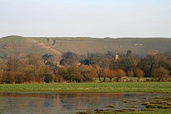 Child Okeford village and Hambledon Hill viewed from watermeadows by the River Stour Child Okeford and Hambledon Hill 20070207.jpg