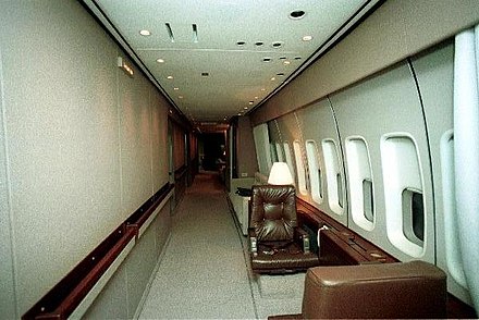 The aircraft's port-side (left) corridor. The two chairs are typically occupied by Secret Service agents.