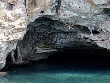 Climber on Smash it in! 8a (5.13b), Cala Varques, Mallorca. DWS Cala Varques Mallorca.jpg