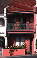 Characteristic Paddington, Sydney terraced house with wrought iron balcony