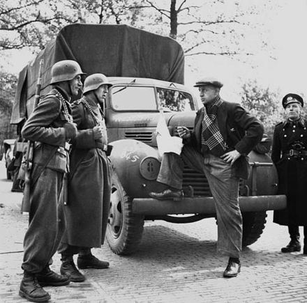 Feldgendarmerie guard a food truck in the Netherlands in 1945.