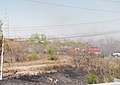 Grassfire being controlled by firefighters during the Mexican fire season of 2021 and the 2021 North American drought