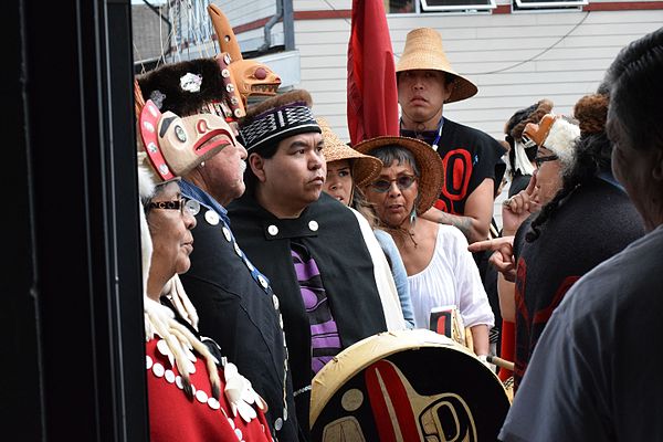 Haida wait for their Heiltsuk hosts to welcome them to sing and dance at a peace potlatch in Waglisla.