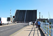 Haven Bridge; one of the two main links to the town pictured in its upright position allowing boats to pass beneath. Haven Bridge Lifted.jpg
