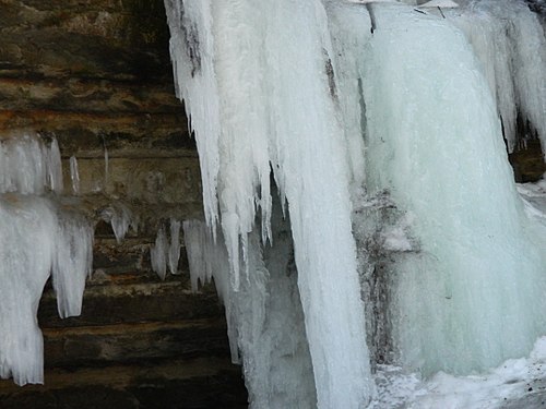 An image taken in the Eben Ice Caves. This is a seasonal tourist attraction in the Upper Peninsula of Michigan. This particular image is of ice flowing down onto a small rock shelf.