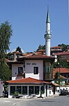 House of Spite, with a terrace next to the Miljacka river.