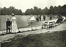 Children sailing their boats on the Round Pond at Kensington Gardens in 1896